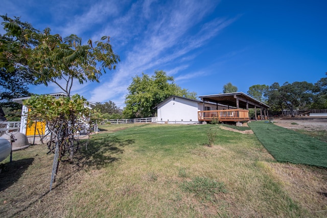 view of yard with a wooden deck