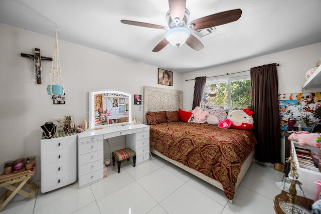 bedroom with ceiling fan and light tile patterned flooring