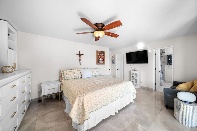 bedroom featuring ceiling fan and ensuite bathroom