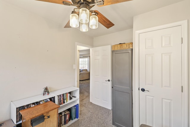 game room with ceiling fan and carpet
