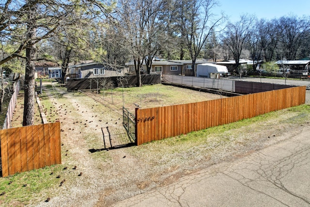 view of yard with fence and a residential view