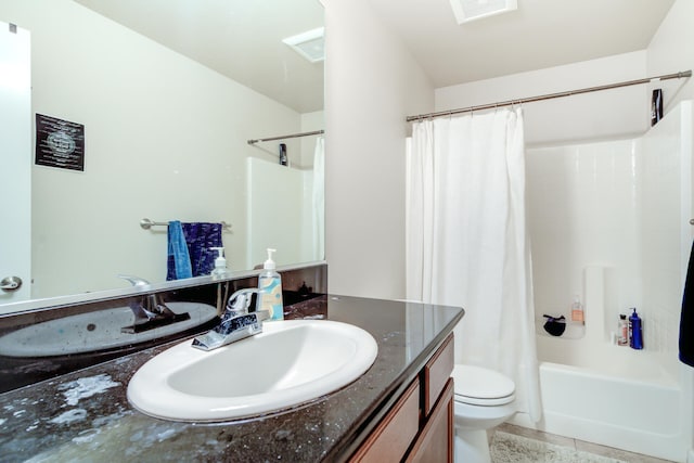 full bathroom with vanity, shower / bath combo with shower curtain, toilet, and tile patterned floors