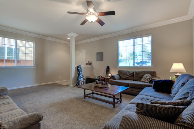 living room featuring carpet floors, ornamental molding, decorative columns, and ceiling fan