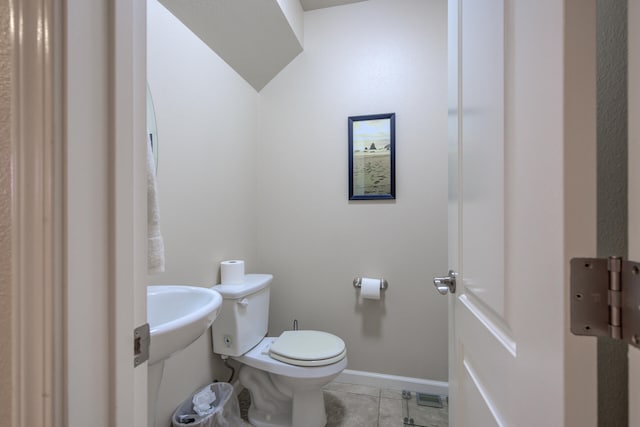 bathroom featuring tile patterned floors and toilet