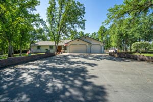 single story home featuring a garage