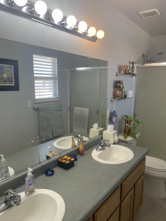 3471 Charles St, Cottonwood, CA 96022 - full bath with a stall shower, visible vents, and a sink