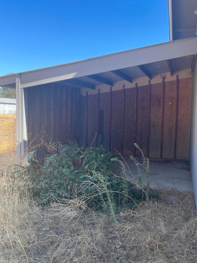 exterior space with a carport