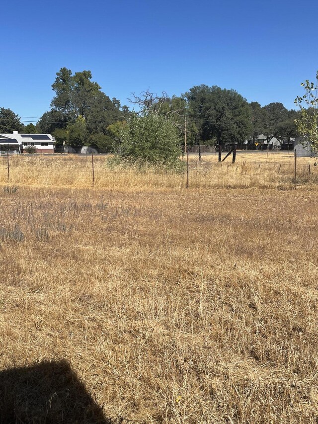 view of yard with a rural view