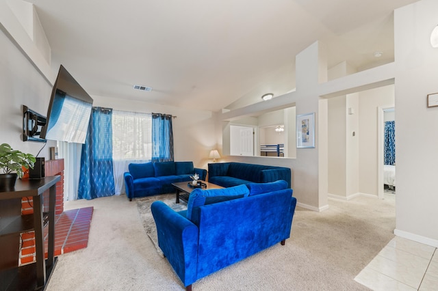 living room with vaulted ceiling and light colored carpet