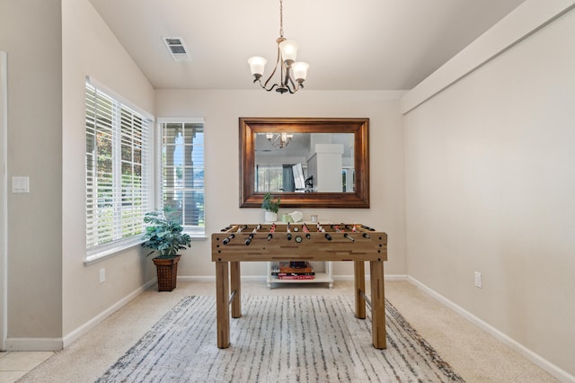 interior space featuring a notable chandelier and lofted ceiling