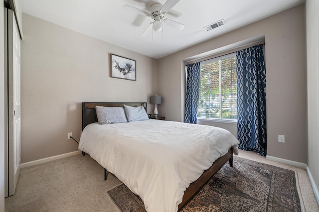 bedroom with ceiling fan and carpet