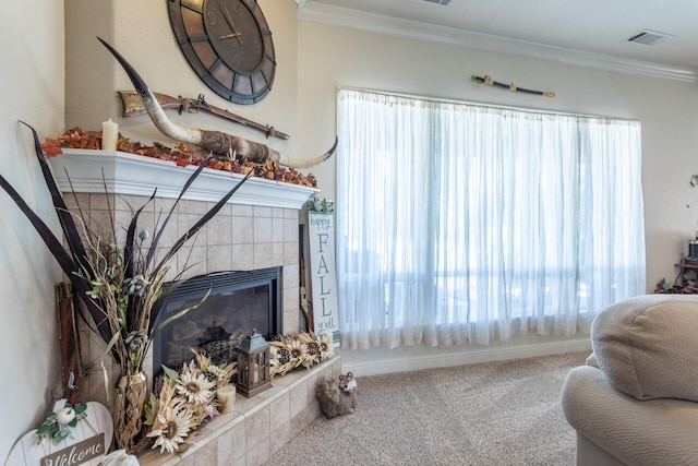 living room featuring a wealth of natural light, a fireplace, carpet, and ornamental molding