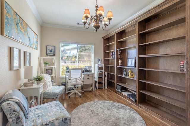 sitting room with a chandelier, light hardwood / wood-style flooring, and crown molding