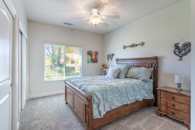 bedroom featuring ceiling fan and light colored carpet