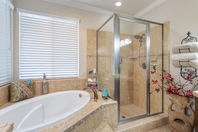 bathroom featuring ornamental molding and plus walk in shower