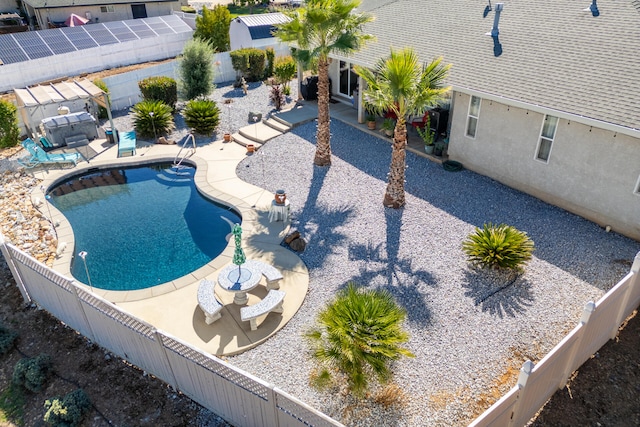 view of swimming pool with a patio