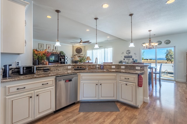 kitchen with dishwasher, sink, decorative light fixtures, ceiling fan with notable chandelier, and light wood-type flooring