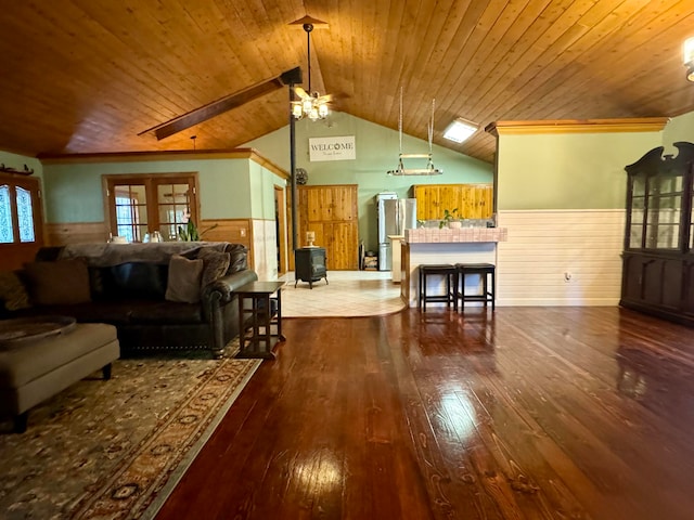 living room with wood-type flooring, vaulted ceiling, and wooden ceiling