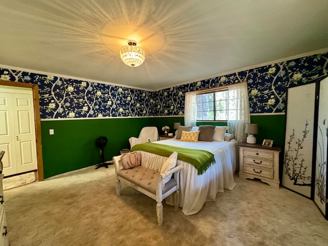 bedroom with light carpet, a closet, and a textured ceiling