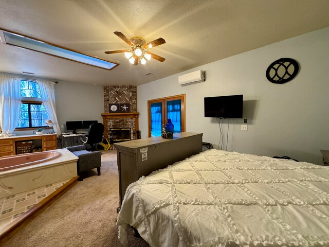 carpeted bedroom with a textured ceiling, ceiling fan, a fireplace, and a wall mounted AC