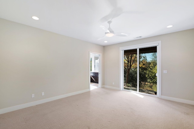 carpeted empty room with ceiling fan