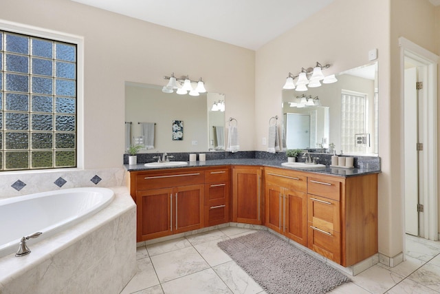 bathroom featuring vanity and a relaxing tiled tub