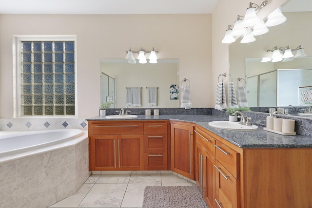 bathroom featuring separate shower and tub and vanity