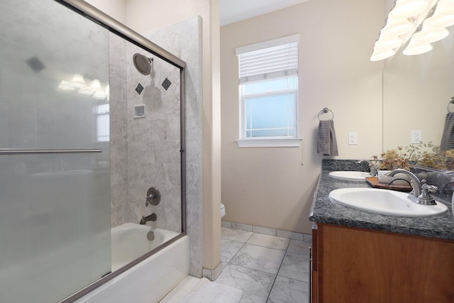 full bathroom with vanity, toilet, and bath / shower combo with glass door