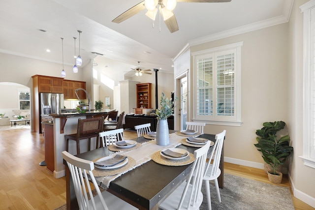 dining room with light hardwood / wood-style floors and ornamental molding