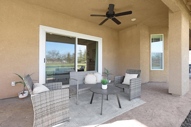 view of patio featuring ceiling fan