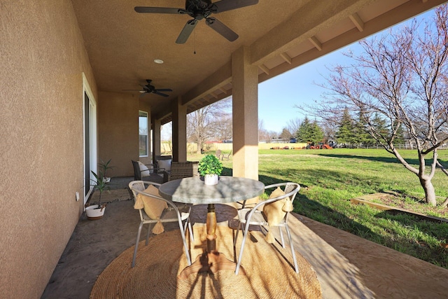 view of patio featuring ceiling fan