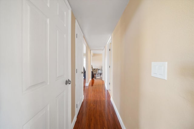 hall featuring dark wood-type flooring