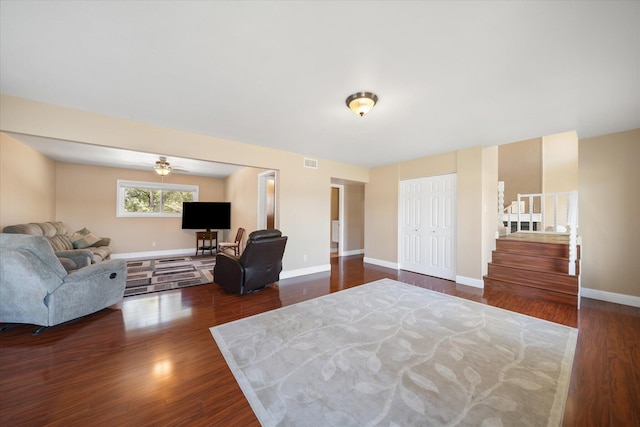 interior space with ceiling fan and dark hardwood / wood-style floors