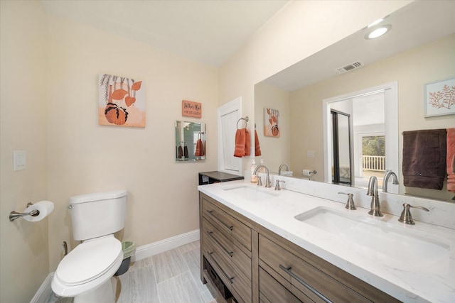 bathroom with vanity and toilet