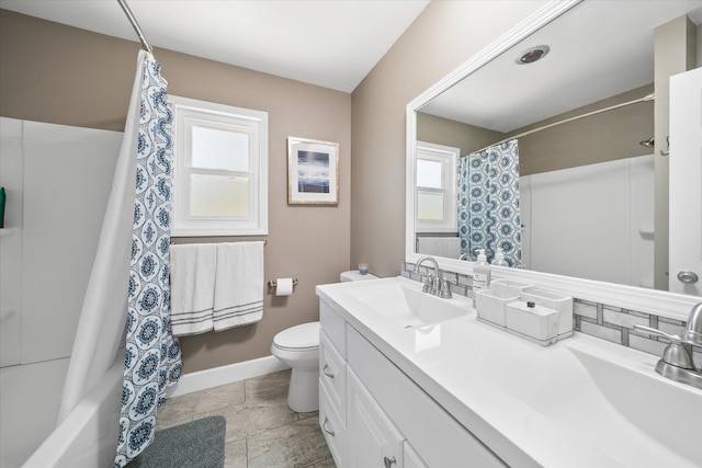 full bathroom featuring vanity, plenty of natural light, toilet, and shower / bathtub combination with curtain