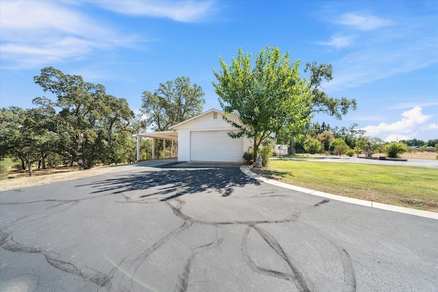 view of front facade with a front yard and a garage