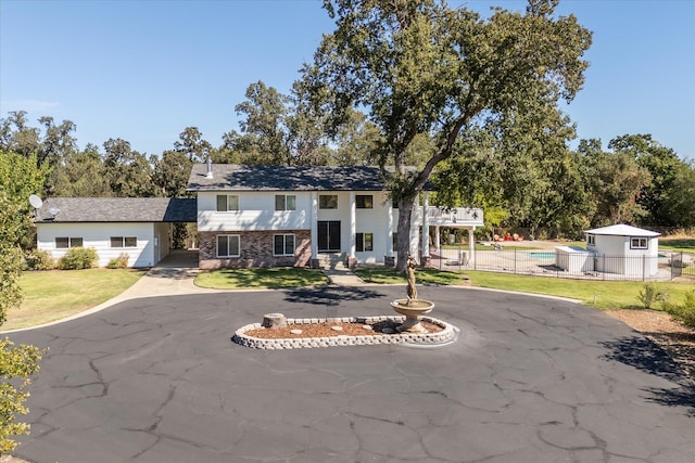 raised ranch with a front lawn