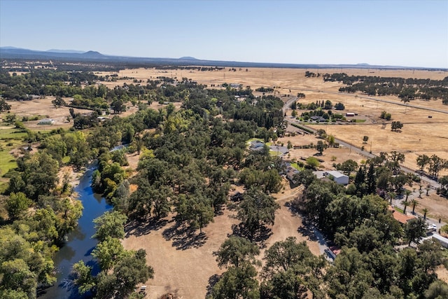 birds eye view of property featuring a rural view and a water and mountain view