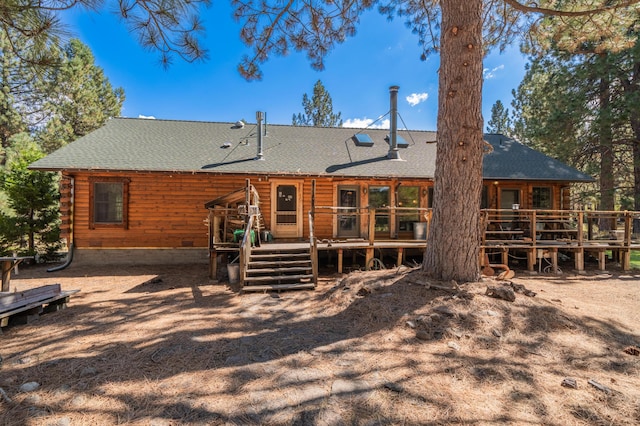 back of property featuring a deck