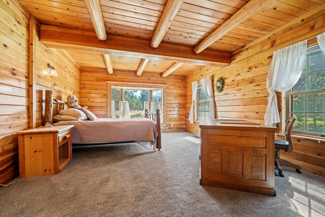 bedroom with wooden walls, beam ceiling, carpet, and wooden ceiling