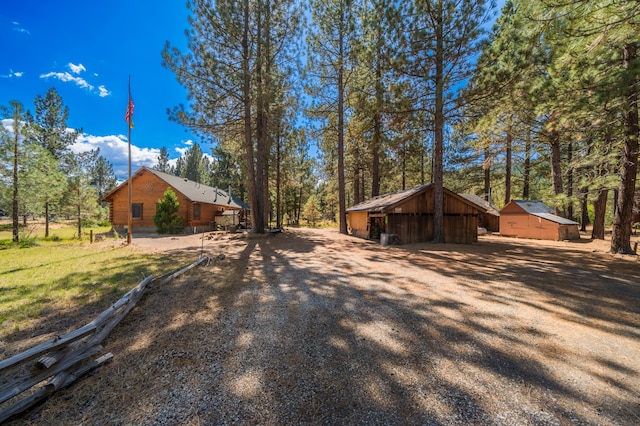 view of side of property with an outdoor structure