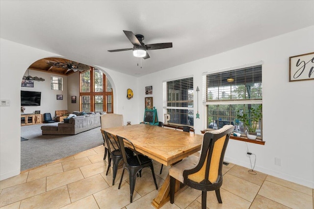 tiled dining room with ceiling fan