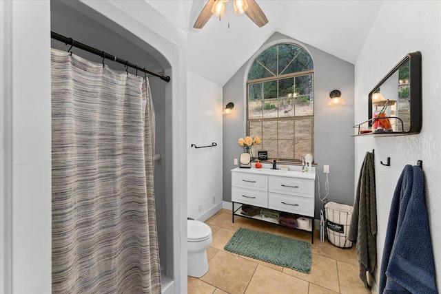 bathroom featuring lofted ceiling, tile patterned floors, ceiling fan, vanity, and toilet