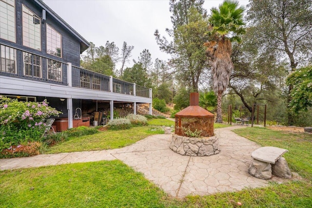 view of yard featuring a patio and a deck