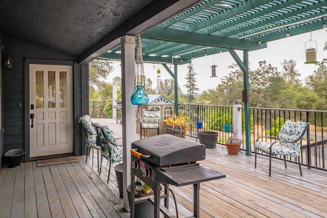 wooden terrace featuring area for grilling and a pergola