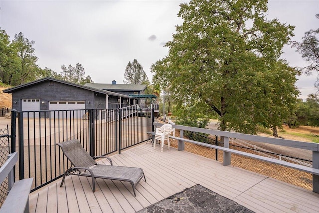 wooden deck featuring a garage