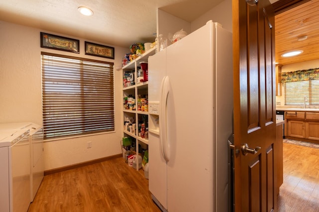 pantry with sink and washing machine and dryer