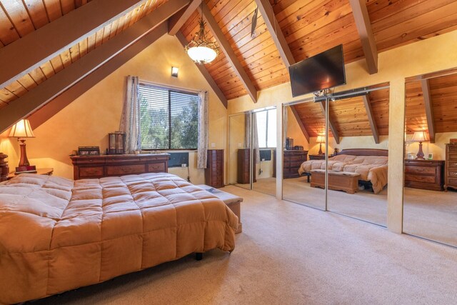 bedroom with carpet flooring, beamed ceiling, and multiple windows