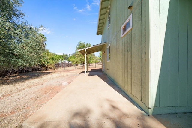 view of property exterior featuring a patio area