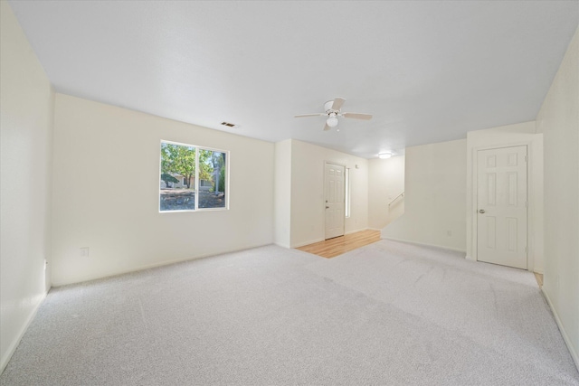 empty room with light carpet and ceiling fan